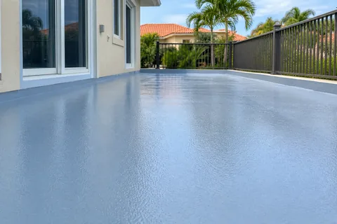 Waterproof membrane applied to a residential deck surface